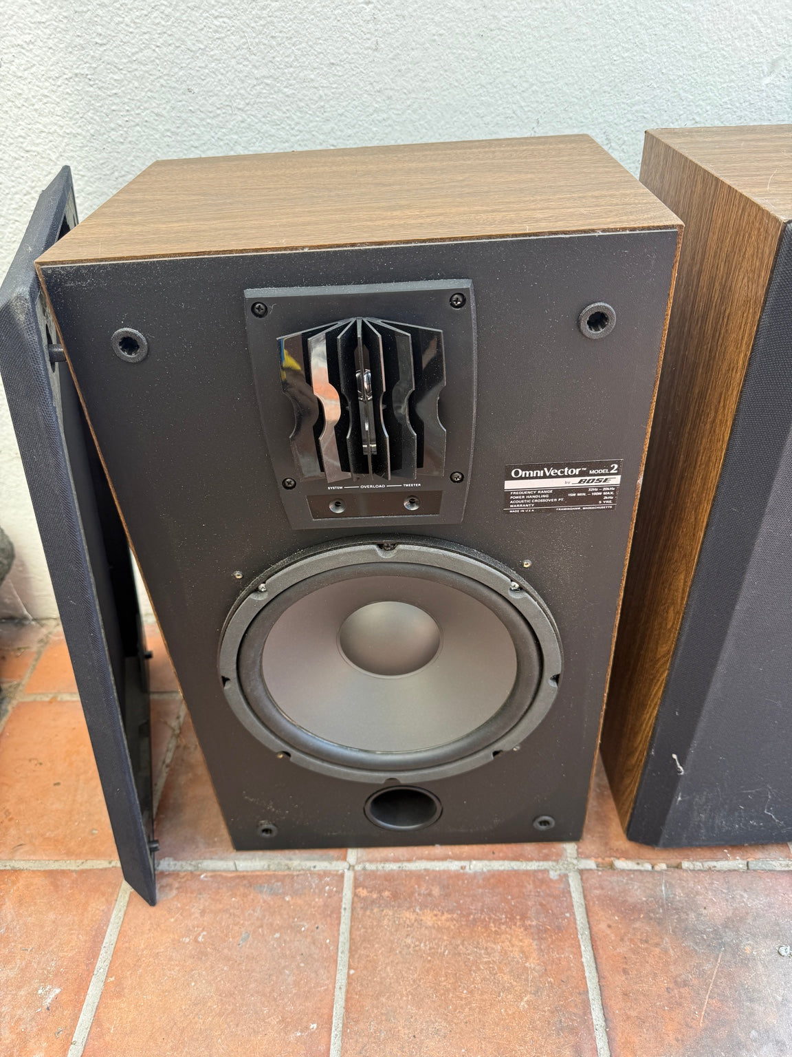 Bose OmniVector Model 2 speaker with grille removed showing woofer and OmniVector tweeter