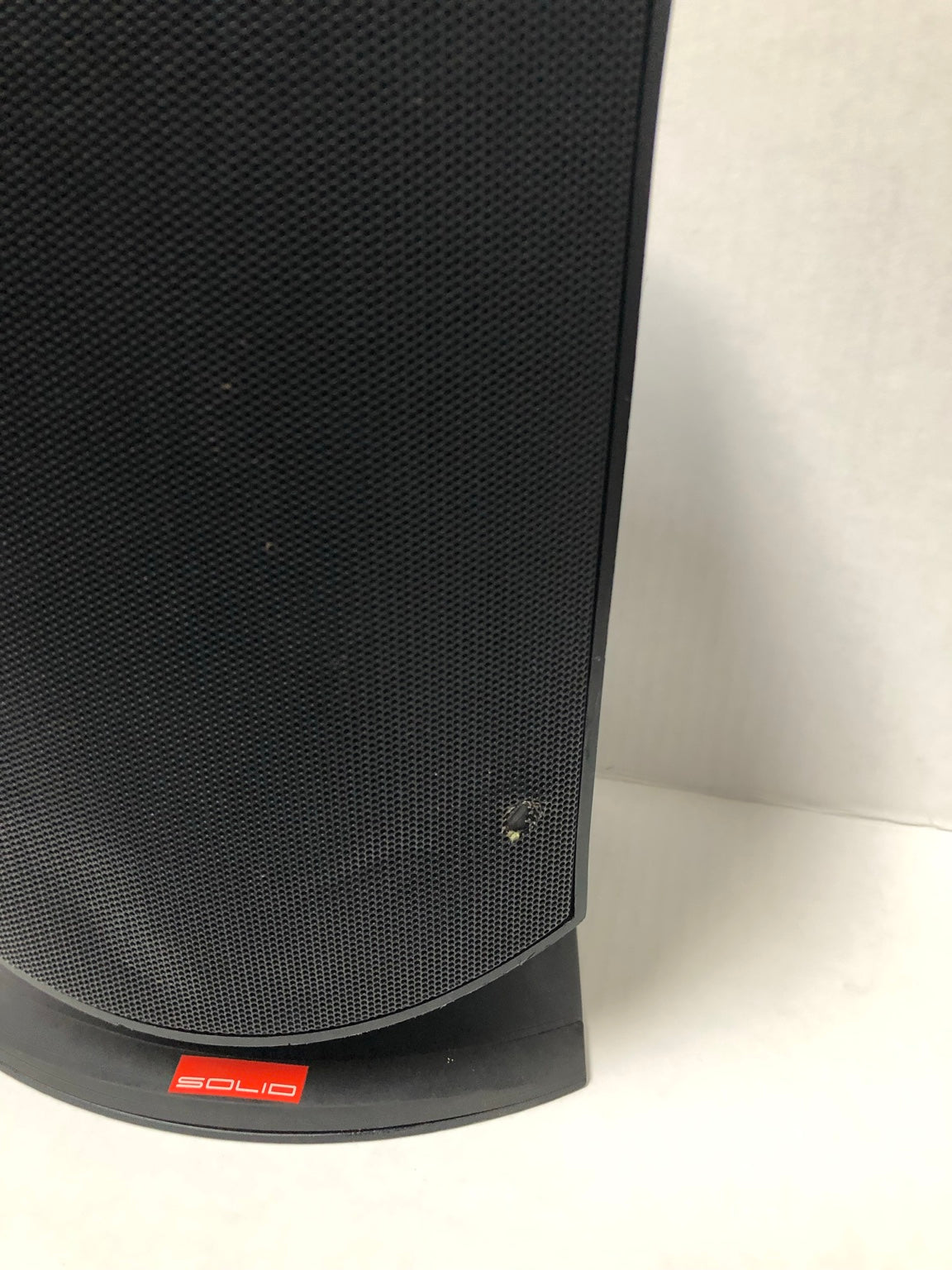 Rock Solid Sounds speaker grille showing small hole and cosmetic damage